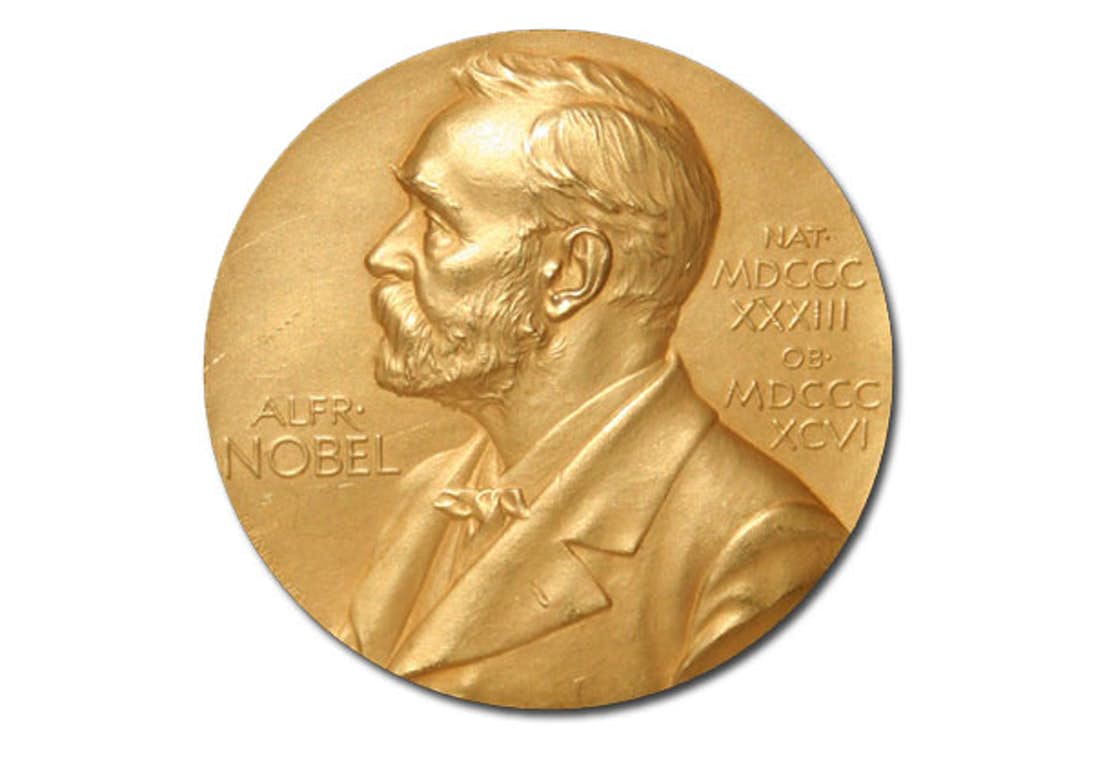 Gold medal with silhouette of a man, name tagged Alfred Nobel. Illustration.