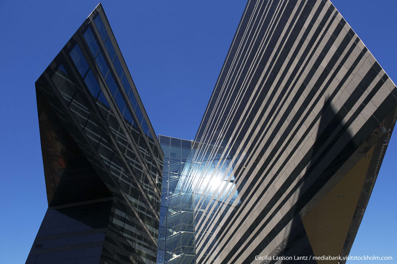 View of arcitetural building against blue sky. Photo. 